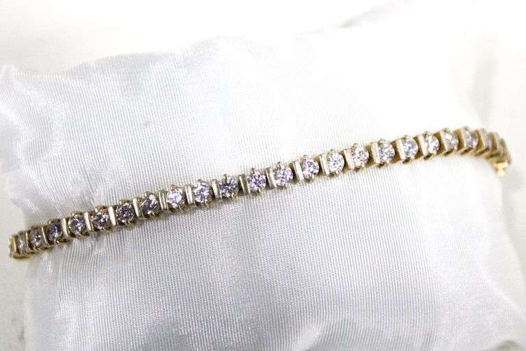 18 KT Gold over Sterling Silver Tennis Bracelet set with clear stones