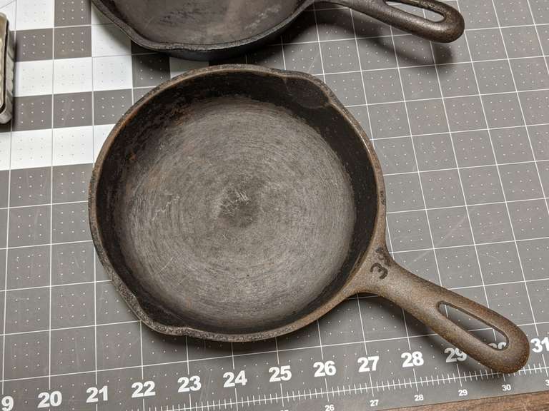 SMALL CAST IRON SKILLETS AND COOKIE MOLDS Bid On Estates Auction Services