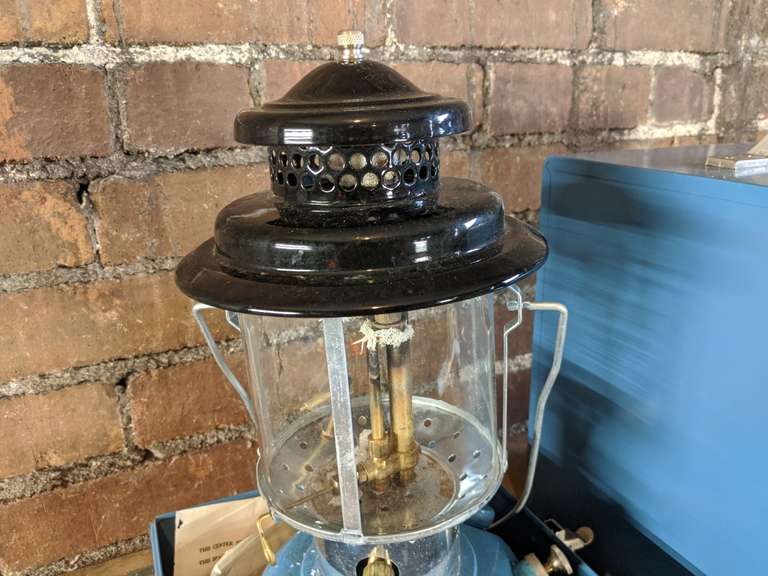 sears camping lantern in blue case Bid On Estates Auction Services