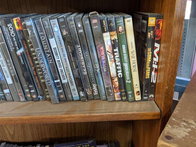 Bookcase. Includes DVDs Bid On Estates