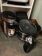Large lot of electric kitchen appliances, crockpots miscellaneous includes shelf.