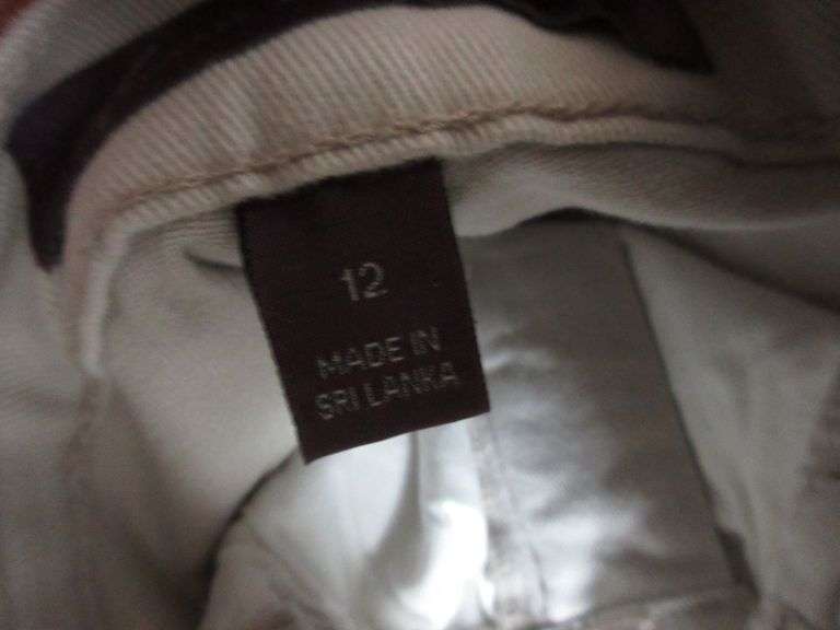 Contents of Closet: Skirts, Pants, Books, Hats, More
