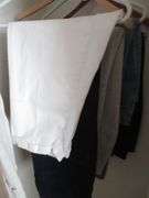 Contents of Closet: Skirts, Pants, Books, Hats, More