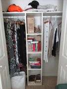 Contents of Closet: Skirts, Pants, Books, Hats, More