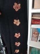 Contents of Closet: Skirts, Pants, Books, Hats, More