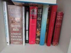 Contents of Closet: Skirts, Pants, Books, Hats, More