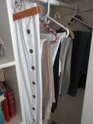 Contents of Closet: Skirts, Pants, Books, Hats, More