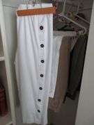 Contents of Closet: Skirts, Pants, Books, Hats, More