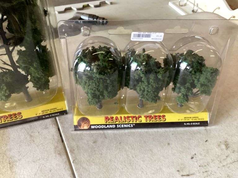 2 MODEL TRACTOR DISPLAY CASES AND NEW MODEL TREES Currie Auction Service