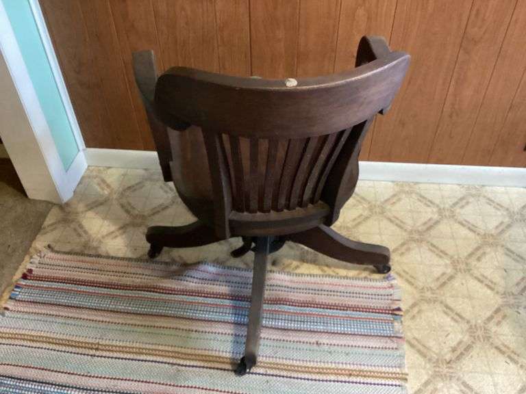 ANTIQUE WOODEN OFFICE CHAIR ON WHEELS Currie Auction Service