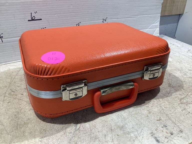 SMALL ORANGE HARDSHELL TRAVEL CASE Currie Auction Service