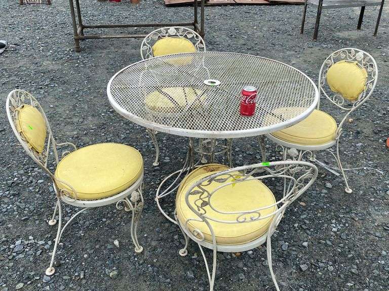 Wrought iron outdoor patio table and chairs Dixon's Auction at Crumpton
