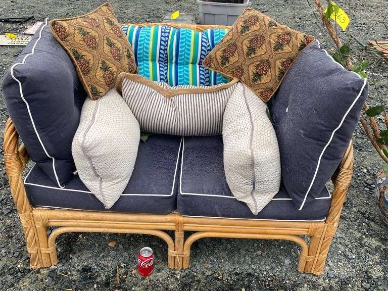 Wicker/rattan loveseat sofa plant and planter stored outside Dixon's