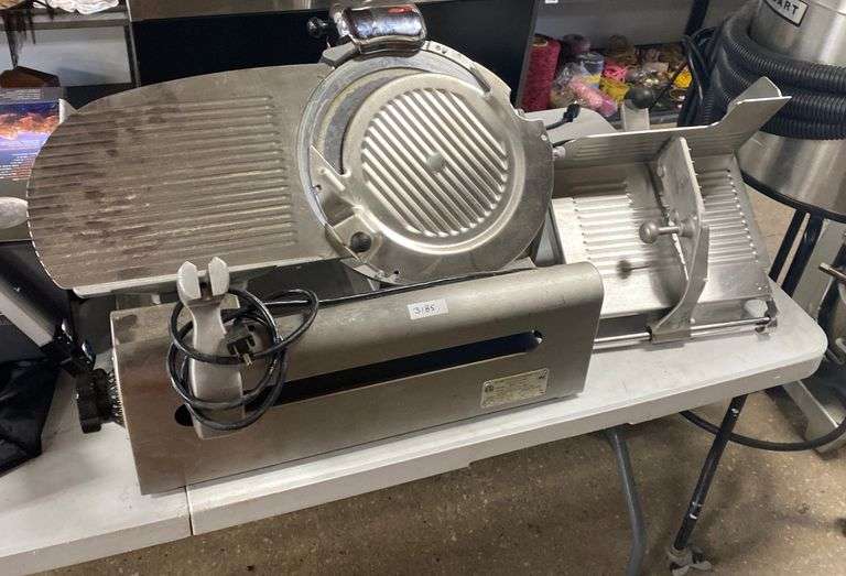 Globe commercial grade meat slicer. Used. Dixon's Auction at Crumpton