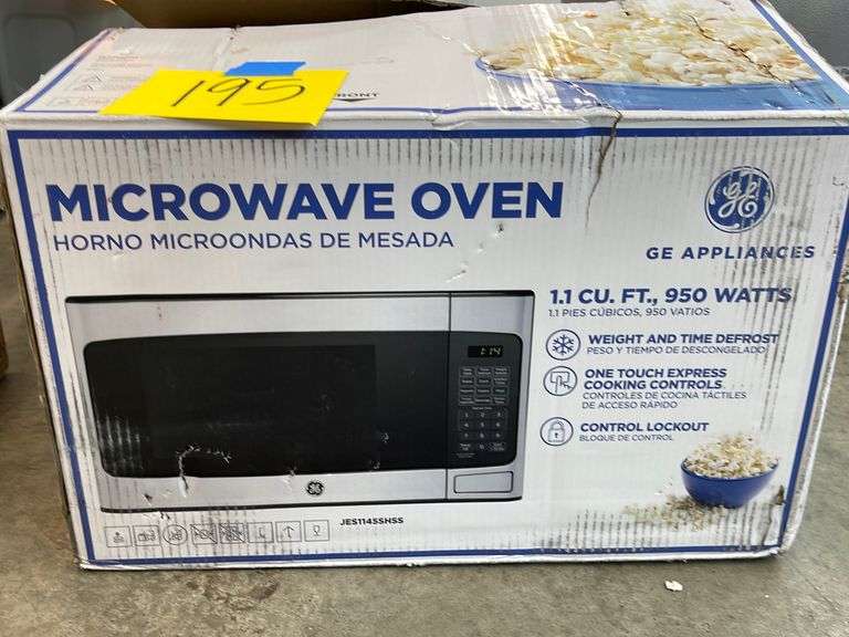 GE MICROWAVE OVEN IN BOX Earl's Auction Company