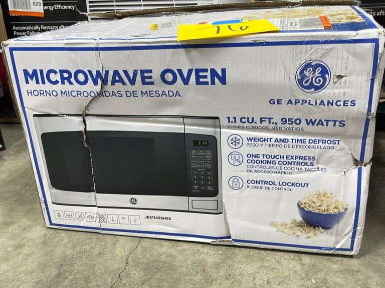 GE MICROWAVE OVEN IN BOX Earl's Auction Company