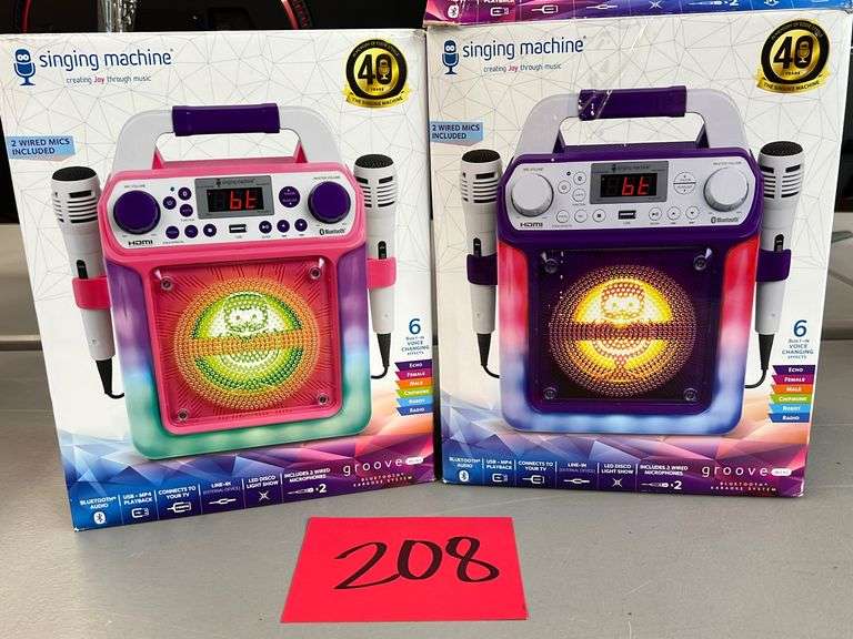 (2) SINGING MACHINES IN BOXES Earl's Auction Company