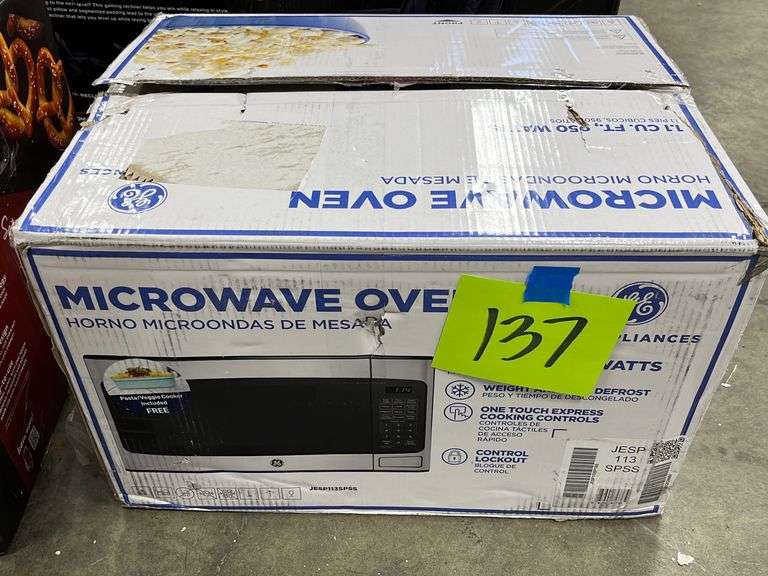 GE MICROWAVE OVEN IN BOX Earl's Auction Company