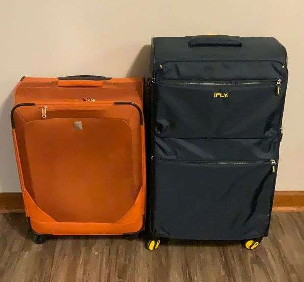 Two Large Rolling Suitcases 32”H x 17”W x 12”D & 25”H x 18”W x 10”D