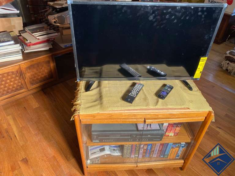 Roku T.V.; Wood T.V. Stand; Magnavox DVD/VCR Player and Assortment of
