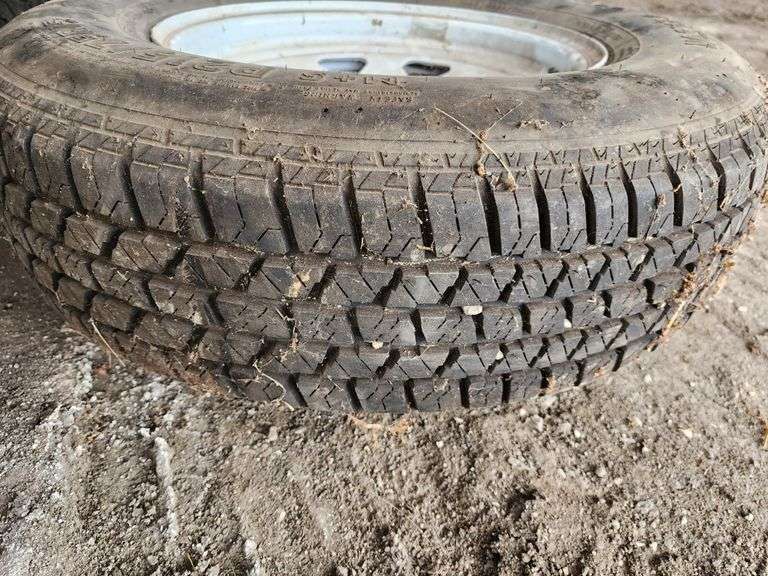 P215/75R15 Tire on 6-Bolt Rim - Fragodt Auction and Real Estate LLC