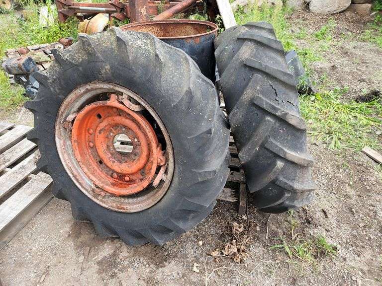 (2) 1124 Tractor Tires with Spin Out Rims, Needs Repair on Rim Sides