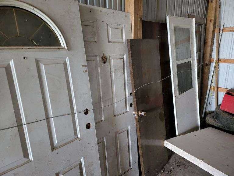 Assortment of Used Doors Fragodt Auction and Real Estate LLC