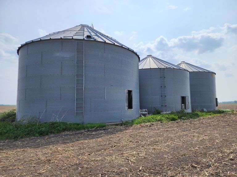 (3) Grain Bins, (2) GSI and Butler 15,000 Bushel Bins and (1) 18,000