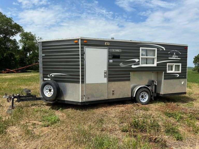 2014 Ice Castle Fish House, 8’ x 16’, 7 Hole, 2 Bunks, Jackknife Sofa