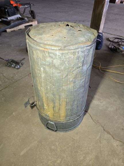 2- GALVANIZED TRASH CANS, 1 FOR SURE HAS A HOLE IN THE BOTTOM.