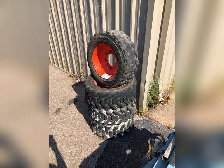 Set of (4) 10 X 16.5 Skidsteer Wheels and Tires (Wichita, Ks) Gavel