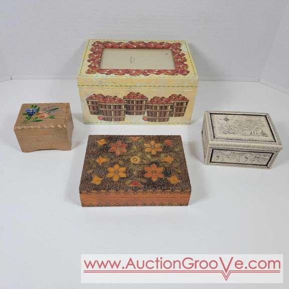 4 boxes. Music box, playing card box, picture frame and the cayman