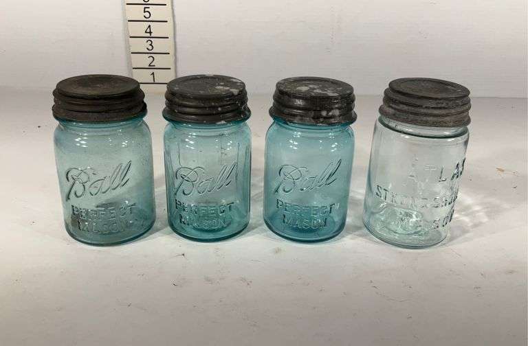 Four pint sized mason jars, includes atlas strong shoulder and three