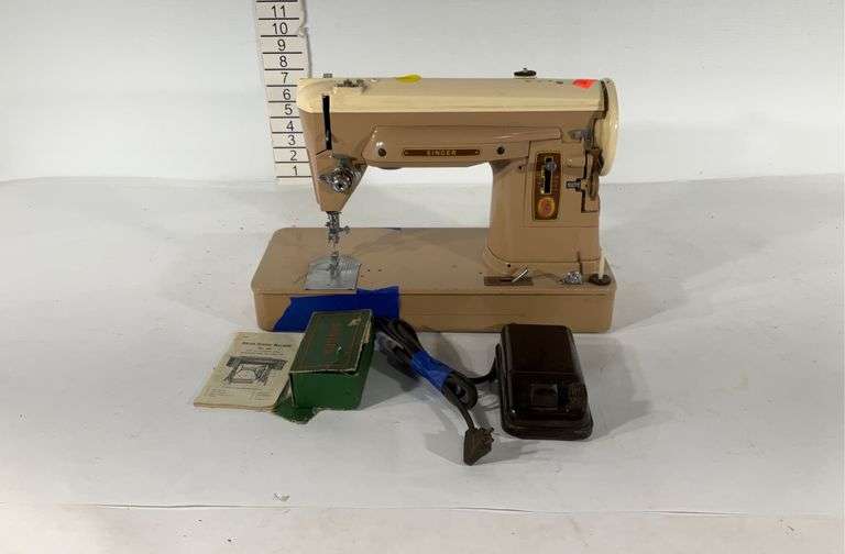 Singer sewing machine, no power cord, seller code QV Hash Auctions