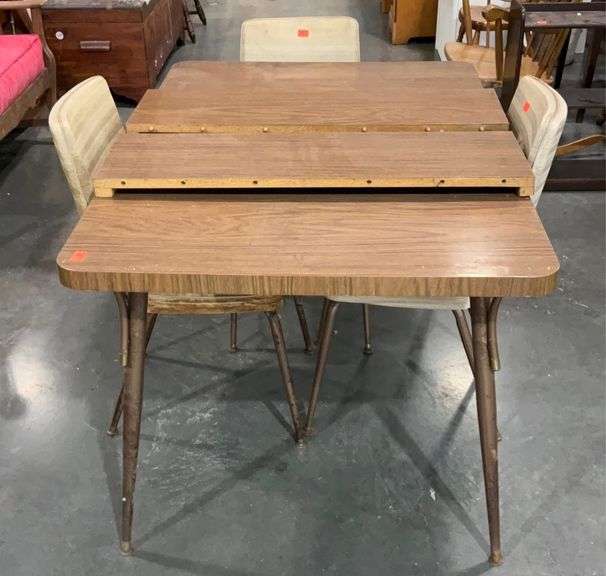 Formica topped table, 50x35 with two 10in inserts, three vinyl chairs