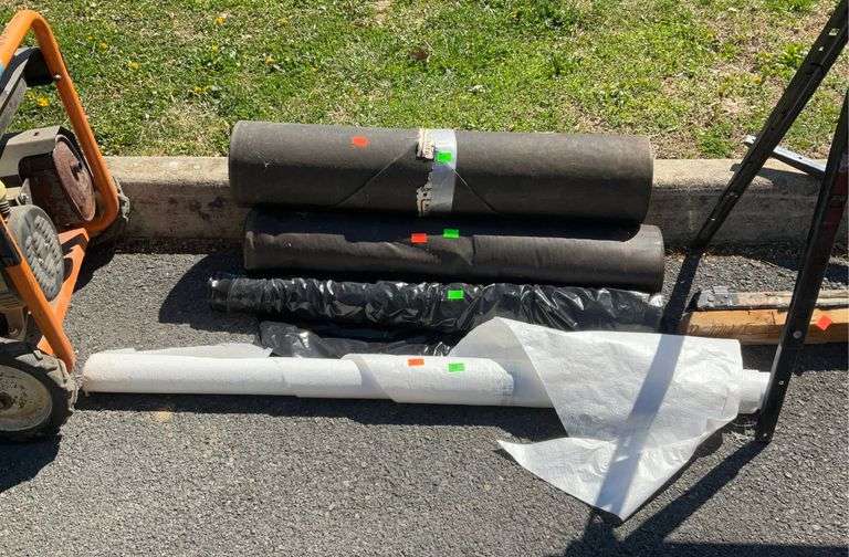 Building materials lot, two roofing paper, one house wrap, and black