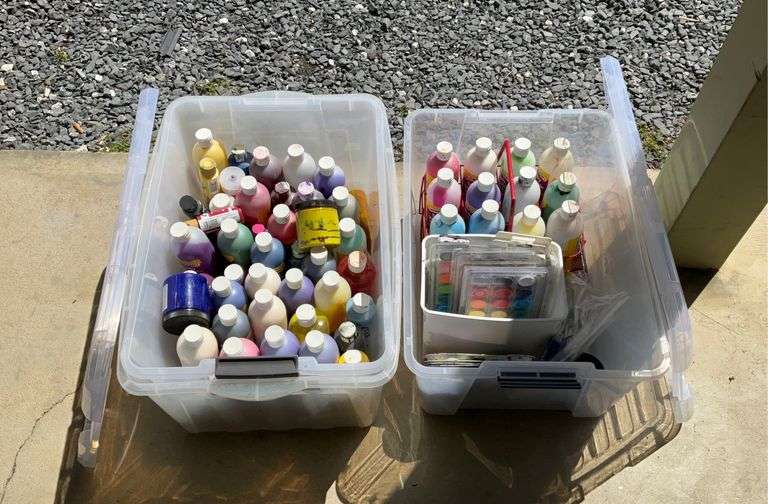 Two clear plastic totes full of paint supplies, seller code IJ Hash
