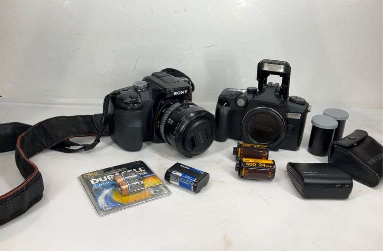 Minolta film camera with rolls of film and accessories, Sony DSLR