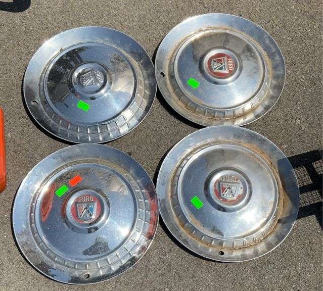 Four Ford hub caps Hash Auctions