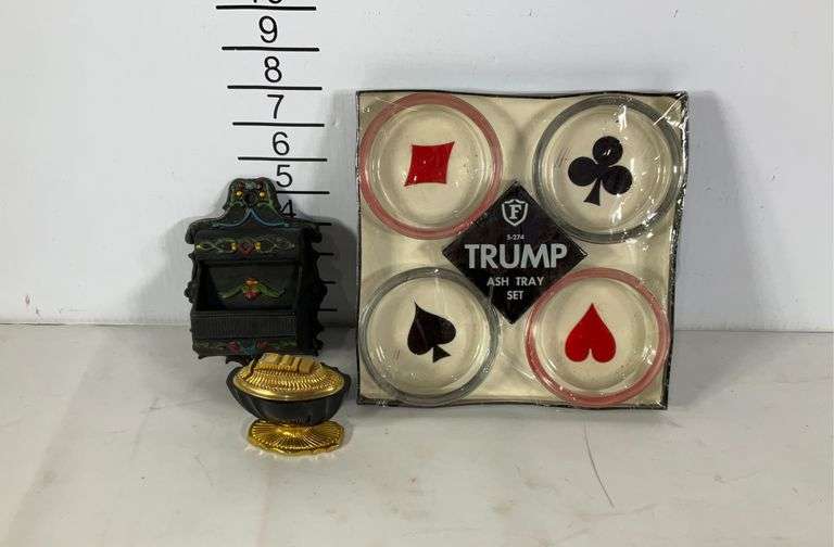 Trump ashtray set, Wilton cast iron match holder, and lighter Hash