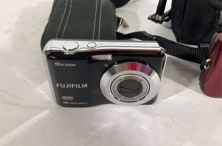 Two digital cameras with cases, Nikon Coolpix and Fujifilm Hash Auctions