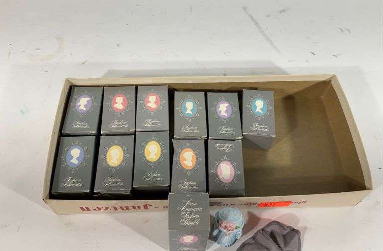 Twelve Avon American fashion thimbles in boxes Hash Auctions