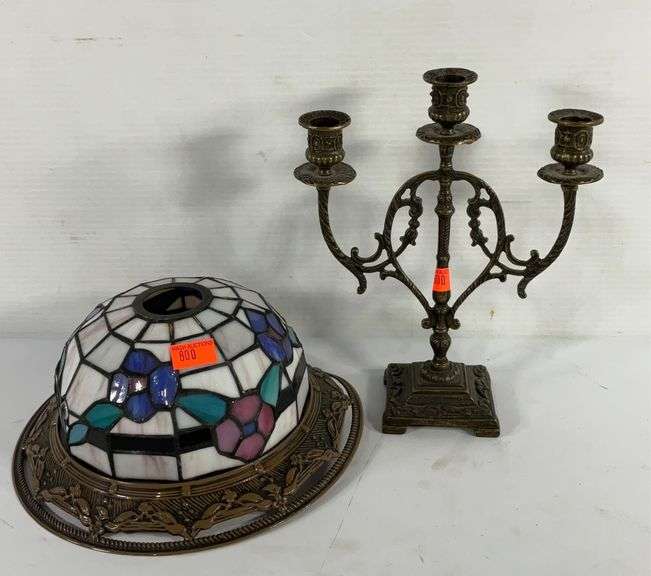 Stained glass lamp shade, brass toned candelabra p, the shade is bent a