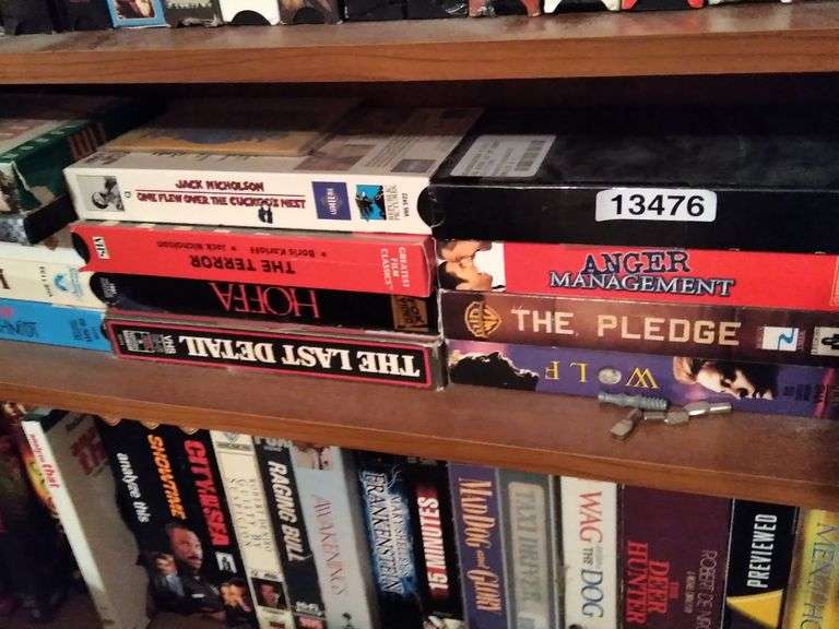 SHELF OF VHS TAPES Dallas Online Auction Company