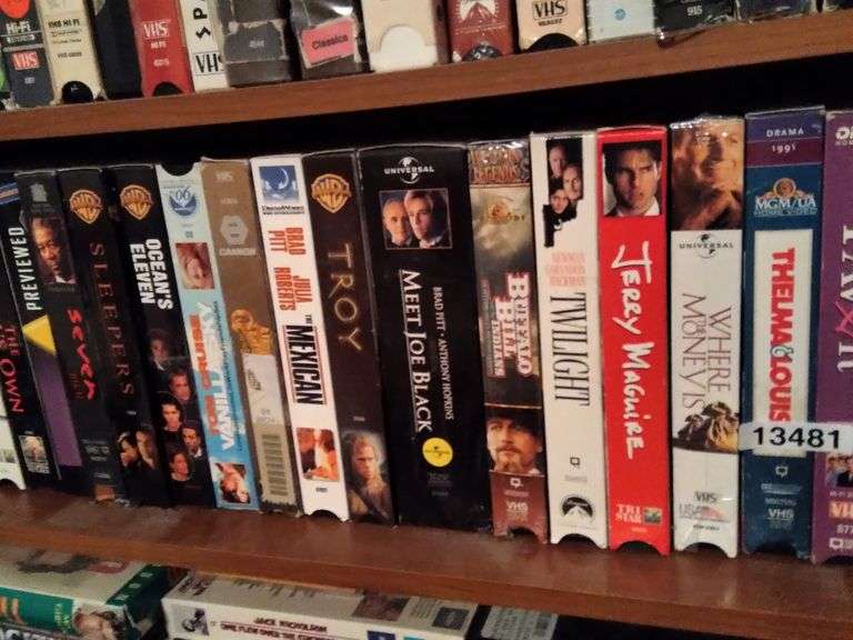 SHELF OF VHS TAPES Dallas Online Auction Company