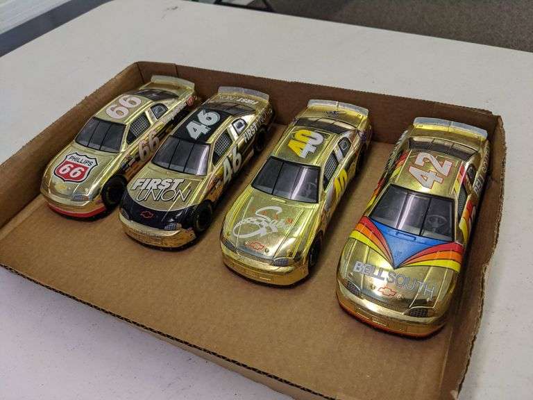 LOT OF (4) 124 SCALE DIECAST RACE CARS Isabell Auction