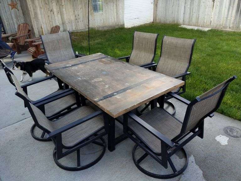 (H) CONCRETE TOP PATIO TABLE WITH (6) SWIVEL ARM CHAIRS Isabell Auction