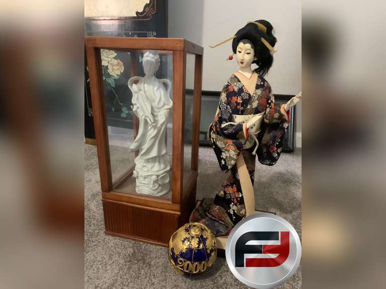 TWO ORIENTAL STATUES AND A GLOBE