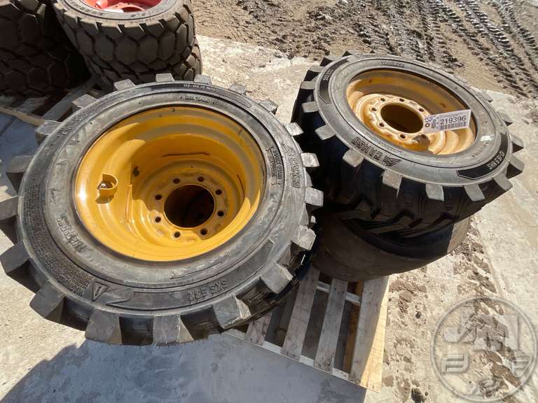 (6) SKID STEER TIRES ON RIMS Fahey Sales Auctioneers & Appraisers