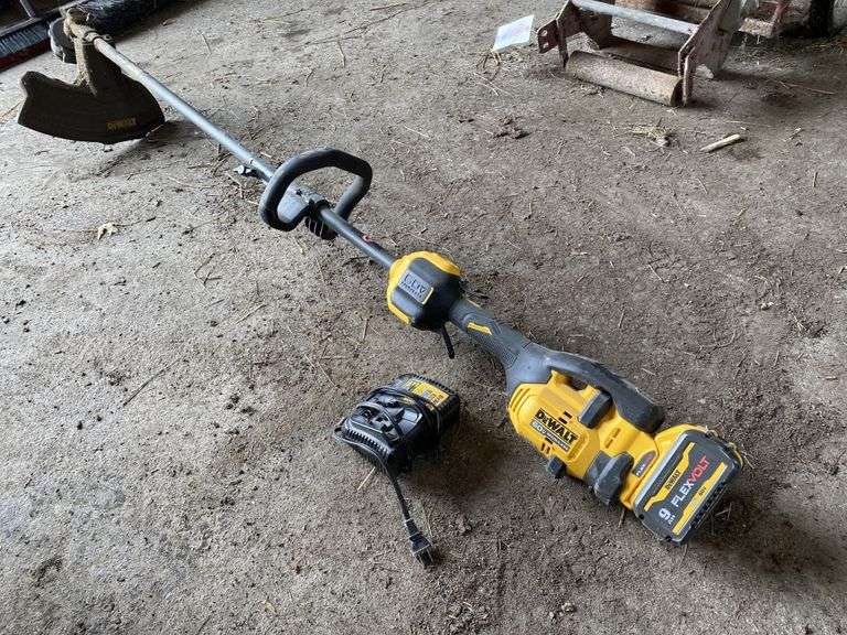 DeWalt 60V string trimmer, battery and charger. Legacy Auction Company